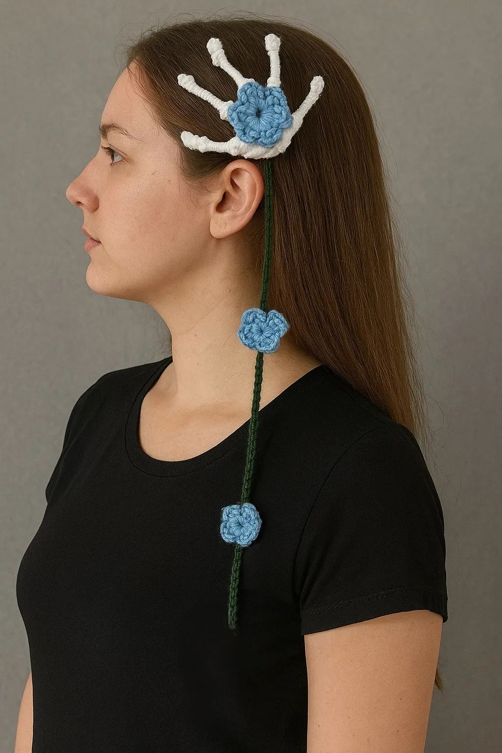 Skeleton hand hair clip with blue cascading crochet flowers